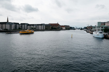 Copenhagen, Denmark - August 12, 2016: Waterfront of Copenhagen with nautical vessel on the water a cloudy summer dayのeditorial素材