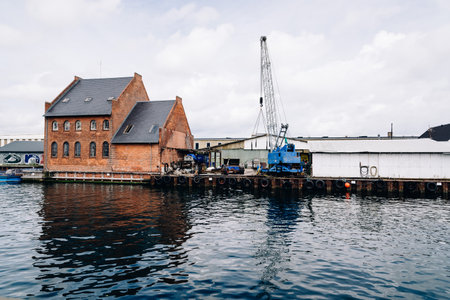 Copenhagen, Denmark - August 12, 2016: Port of Copenhagen with blue crane a cloudy summer dayのeditorial素材