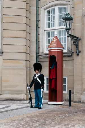 Copenhagen, Denmark - August 12, 2016: The guards of honour guarding the gates of the Royal residence Amalienborg Palace in Copenhagen.のeditorial素材