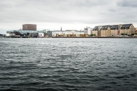 Copenhagen, Denmark - August 12, 2016: Waterfront of Copenhagen a cloudy day of Summer, with Play House Theater on backgroundのeditorial素材