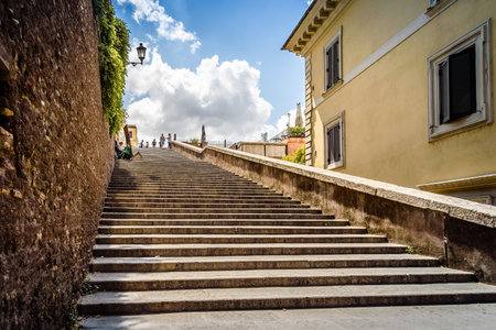 Rome, Italy - August 18, 2016: Lateral staircase to Piazza della Trinita dei Monti with artist...