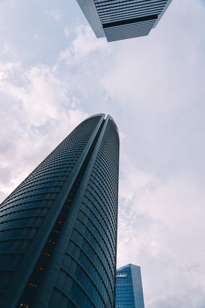 Madrid, Spain - June 25, 2017: Low angle view of  skyscraper in Cuatro Torres Business Area, CTBA, Four Towers Business Area, a business district in Madrid against skyのeditorial素材