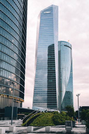 Madrid, Spain - June 25, 2017: Low angle view of skyscrapers in Cuatro Torres Business Area, CTBA (Four Towers Business Area) a business district in Madrid against cloudy skyのeditorial素材