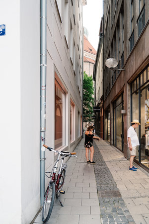 View of street in city centre of Munich at sunsetのeditorial素材