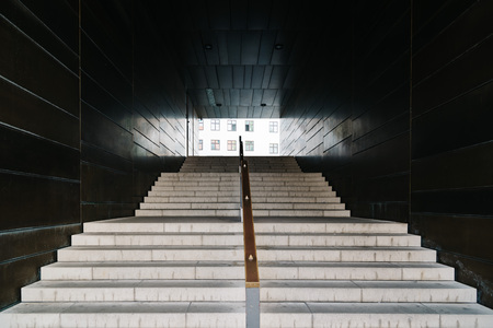 Frontal view of modern staircase in passageway.の写真素材