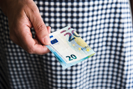 Hand of woman with stack of eurosの写真素材