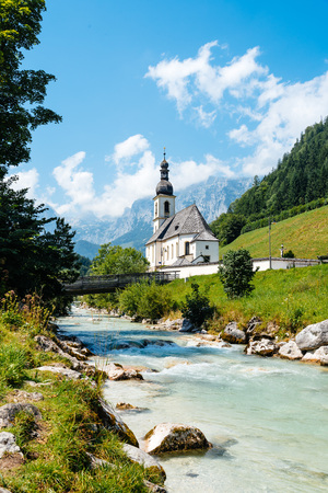 Scenic view of small white church against mountainsの写真素材