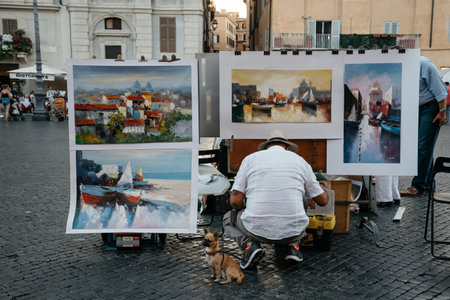 Painter selling his paintings in Piazza Navona in Romeのeditorial素材