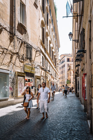 Rome, Italy - August 22, 2016: Tourists walking on the street in historical centre of Rome a sunny summer day.のeditorial素材