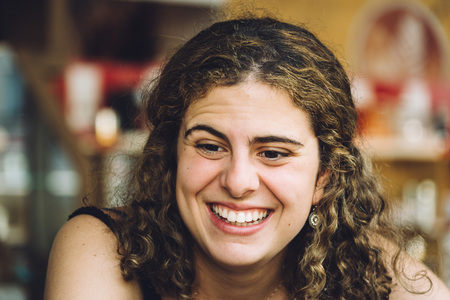 Happy girl laughing against blur background. Concept of joyの写真素材