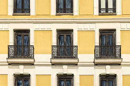 Yellow painted facade of classic residential buildingのeditorial素材