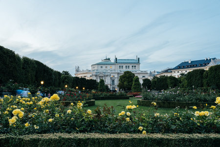 Burgtheater at sunset, view from Volksgarten in Viennaのeditorial素材