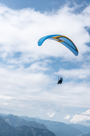 Man paragliding on Hoher Dachstein mountainsのeditorial素材