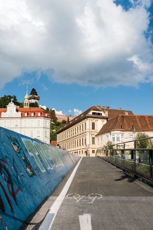 Cyclist bridge over river in Grazのeditorial素材