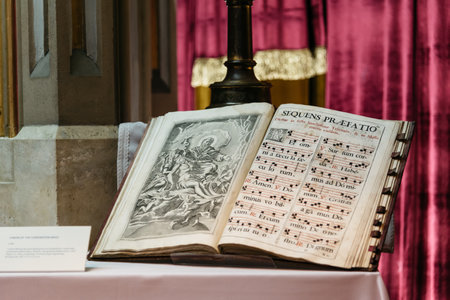 Budapest, Hungary - August 12, 2017:  Old book with music sheets for the Canon for the Coronation Mass. It is in the museum of Matthias Church in Budapestのeditorial素材