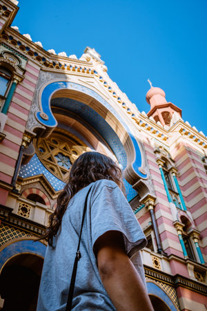 Prague,  Czech Republic - August 18, 2017: Unidentified woman against Jerusalem Synagogue in Prague. Outdoor view.のeditorial素材
