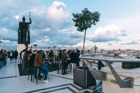 People enjoying at cafe on Circulo de Bellas Artes of Madrid roof