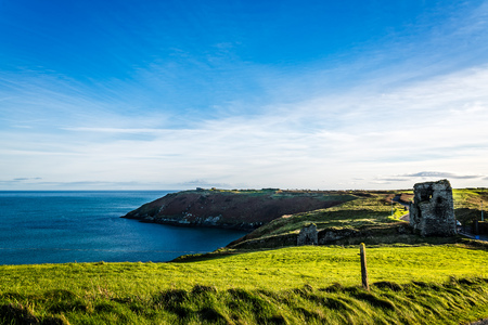 Scenic view of peninsula of Kinsale with green hills at sunsetの写真素材