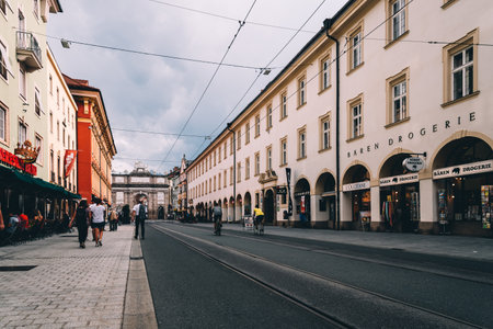 Innsbruck, Austria - August 9, 2017: Maria-Theresien Strasse in historic centre of Innsbruck