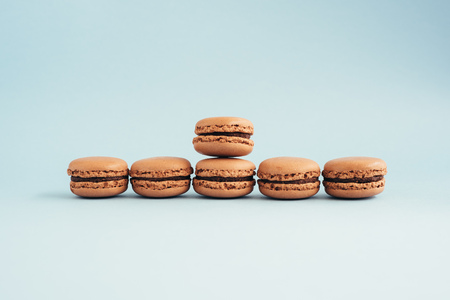 Macarons isolated on blue background