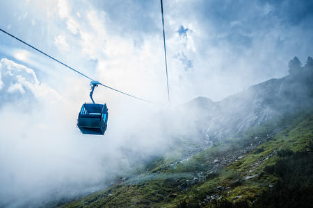 Cable car in mountain a foggy dayの写真素材
