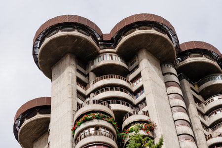 Low angle view of iconic 60s residential skyscraper in Madrid. T