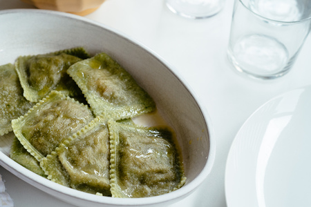 Close up of green raviolis on tableの写真素材