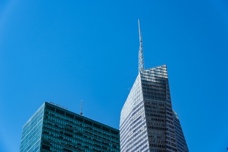 Low angle view of modern office buildings against sky in New Yorの写真素材