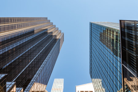 Low angle view of skyscrapers against sky in New York Cityのeditorial素材