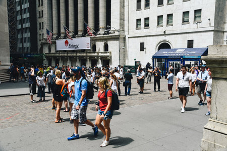 New York City, USA - June 20, 2018: A crowd of people in Wall Street in front of New York Stock Exchange and Federal Hall buildingsのeditorial素材