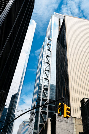 Low angle view of  skyscrapers against blue sky in Financial Dis