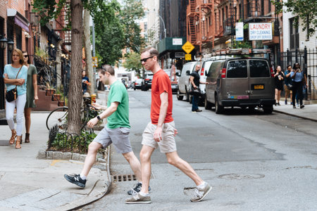 People crossing street in Greenwich Village in NYCのeditorial素材