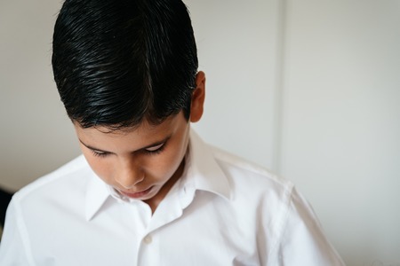 Young boy getting ready for a celebration