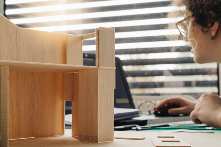 A woman architecture student working on modelsの写真素材