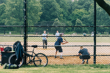 People playing softball in Central Park, NYCのeditorial素材