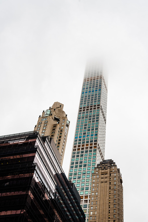 Low angle view of skyscrapers a misty day