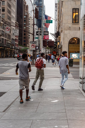 Three young black men walking on Fifth Avenueのeditorial素材