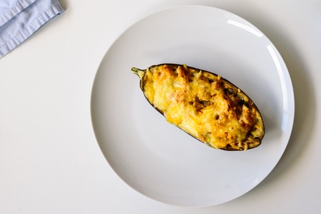 Aubergine stuffed with meat with grated cheeseの写真素材