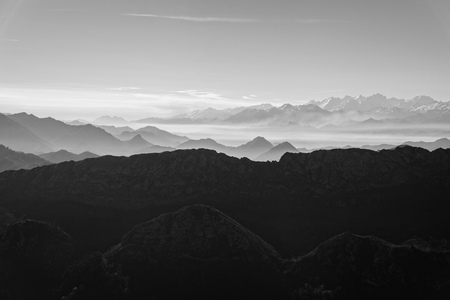 Scenic view of silhouettes of mountains in the morning mistの写真素材
