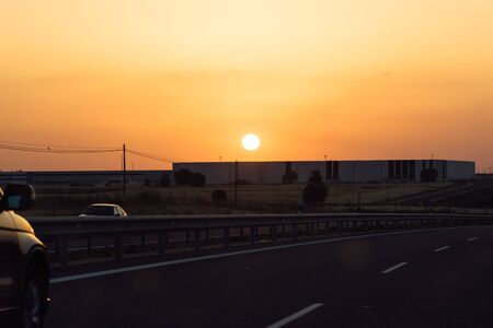 Highway at sunset during heat wave.の写真素材