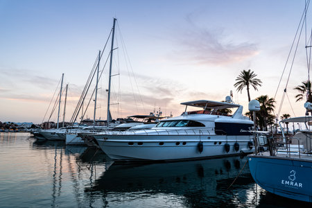 Luxury yachts moored in the Marina of Denia at sunset