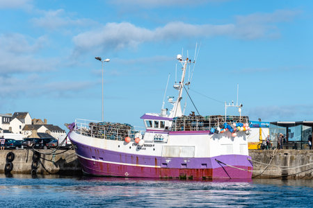 Fishing boat moored in the harbour of Roscoff.