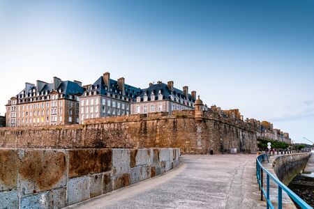 View of the walled city of Saint Malo at sunsetの写真素材