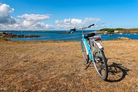 Bicycle parked against the sea in the island of Batzの写真素材