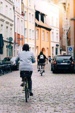 Cyclists riding at the old town of Stralsundのeditorial素材