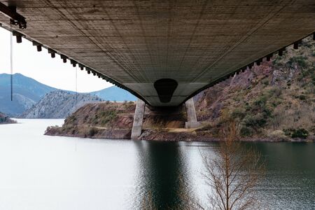 Modern suspension bridge, view under the deckの写真素材