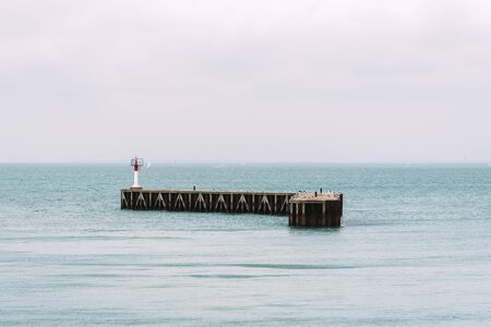 Pier in the entrance to the portの写真素材