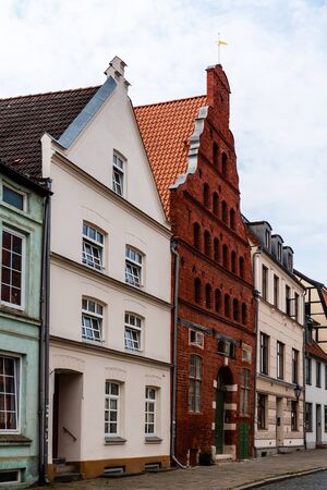 Street view of old gable houses in the old city centre of Wismar. Germanyの写真素材