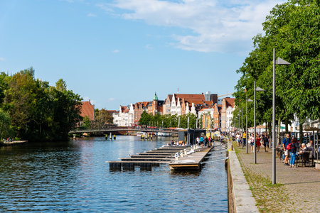 Scenic view of Trave River and waterfront in the old harbour in Lubeck, Germanyのeditorial素材