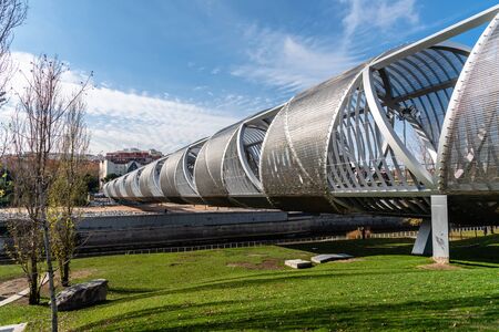 Modern metal footbridge over Manzanares River in Madridの写真素材